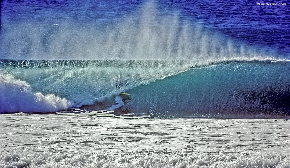 Mike Benevidez, 1977. After getting punished by pounding close-outs at home, every other wave they surfed seemed perfect:  Mike Benevidez traveling down the line. Photo: <a href=\"http://www.surf-shot.com\" target=_blank>Surf-Shot.com</a>